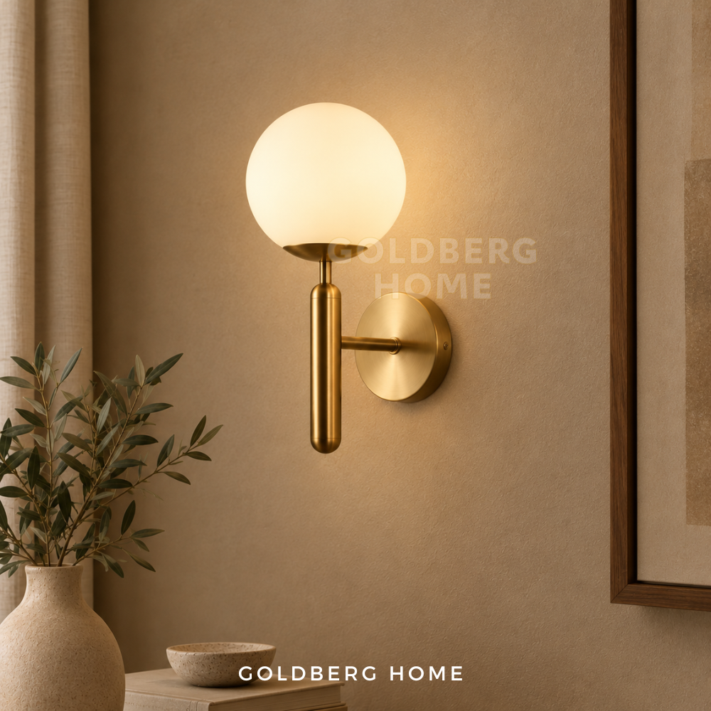 Goldberg Home Christo Classic Luxe Gold & Frosted Wall Lamp installed as elegant bedside night light in contemporary bedroom interior.