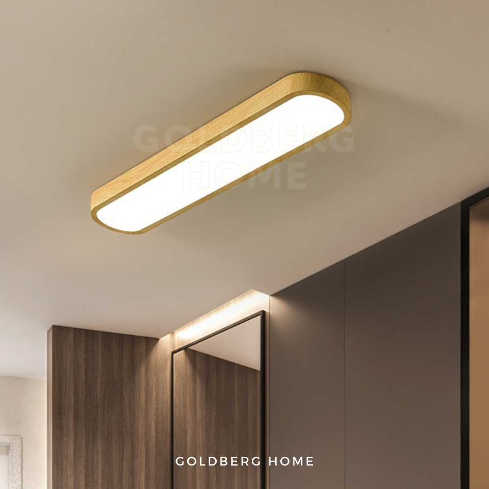LightWood Masako 90cm linear light over a modern Singapore condo kitchen island. Goldberg Home luxury lighting.
