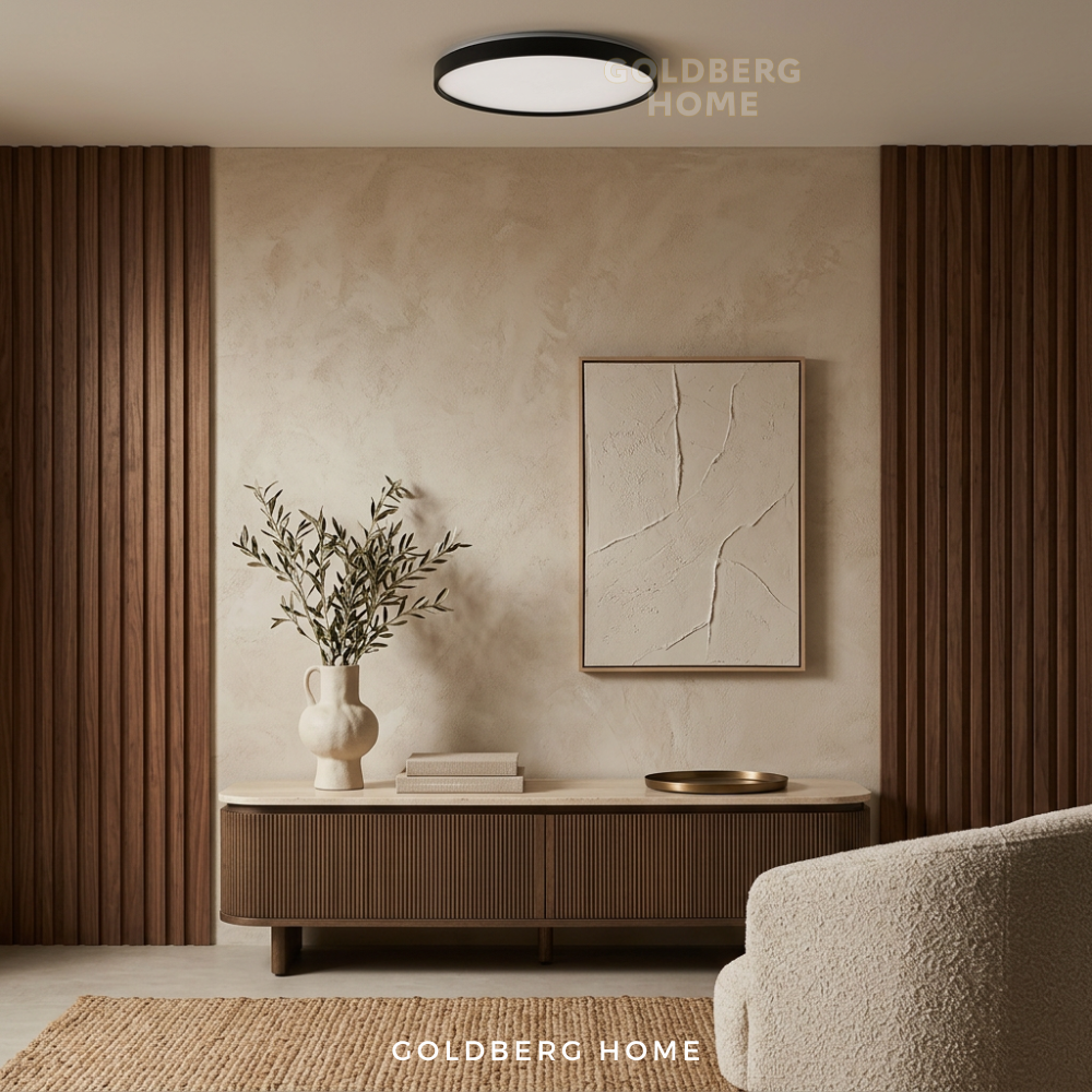 Goldberg Home Sheffield black LED ceiling light installed in modern minimalist living room interior with warm ambiance.