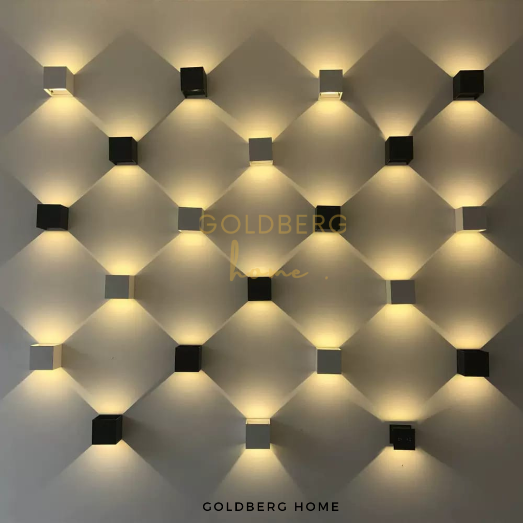 Beautiful wall wash lighting effect using Bristol adjustable lamps by Goldberg Home.