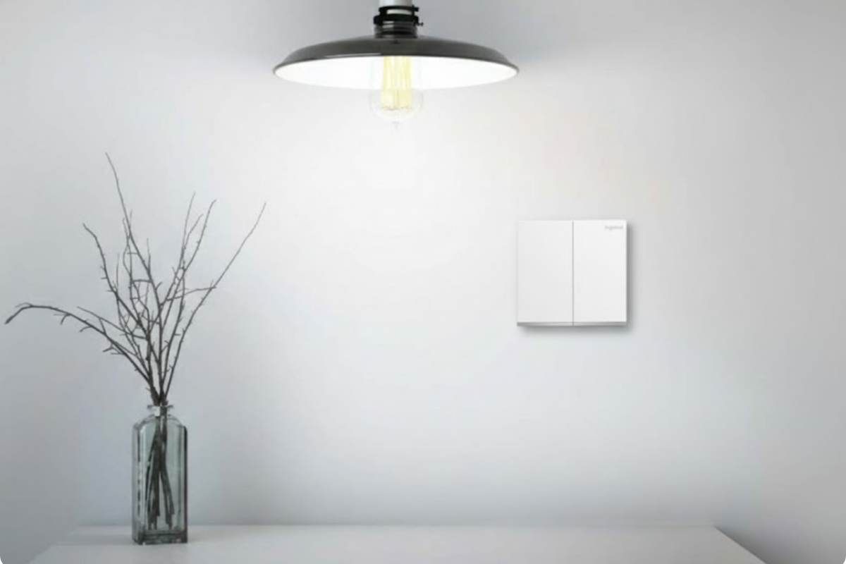 Goldberg Home wall switch beside pendant light in a pristine minimalist Singapore HDB living room