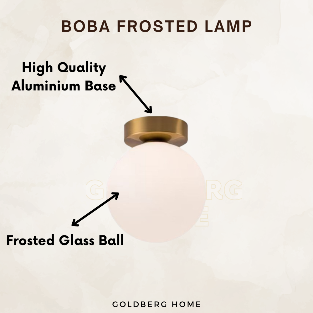 Close-up of the anti-glare frosted glass and brushed gold finish on the Boba lamp.
