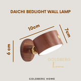 Compact size and adjustment range specs for Goldberg Daichi wooden wall lamp, ideal for bedside or study nooks.