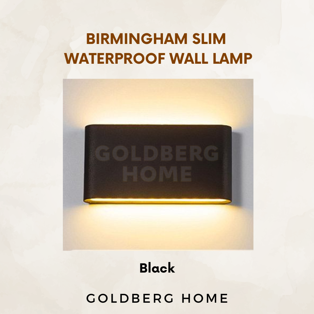 Goldberg Home Birmingham wall lamp illuminating a modern Singapore condo balcony at night.