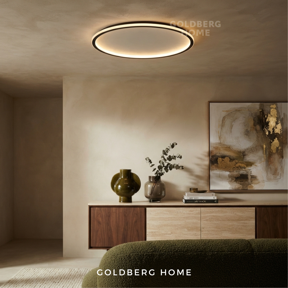 Goldberg Home Halo LED ceiling light with black ring frame installed in modern minimalist living room interior.