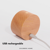 Close-up of USB charging port on Goldberg Daichi lamp, highlighting cordless convenience and long battery life.