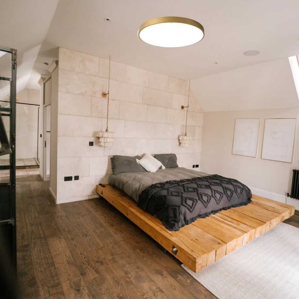 Warm ambient lighting from the Edinburgh gold series in a Singaporean master bedroom.