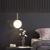 Twin Athena frosted glass pendants used as bedside lights in a luxury Singapore condo master bedroom.