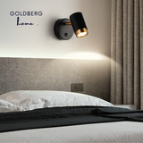 Goldberg Nacht Luxe gold-rimmed wall lamps installed as bedside lights in a luxury Singapore condo.