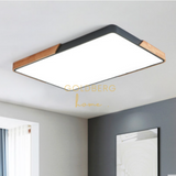 Mariko Nordic rectangle wood light in a spacious Singapore BTO living room. Minimalist Goldberg Home lighting.