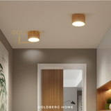 Japanese Series wood downlights illuminating a Muji-style HDB corridor for a warm, welcoming Singapore home entrance.